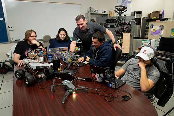 Vincent Nestler (center) with cybersecurity students
