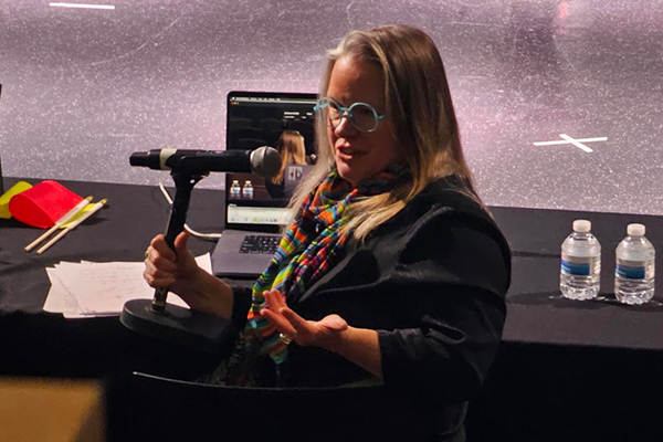 Johanna Smith, professor of theater arts and entrepreneurship, moderated the debate.