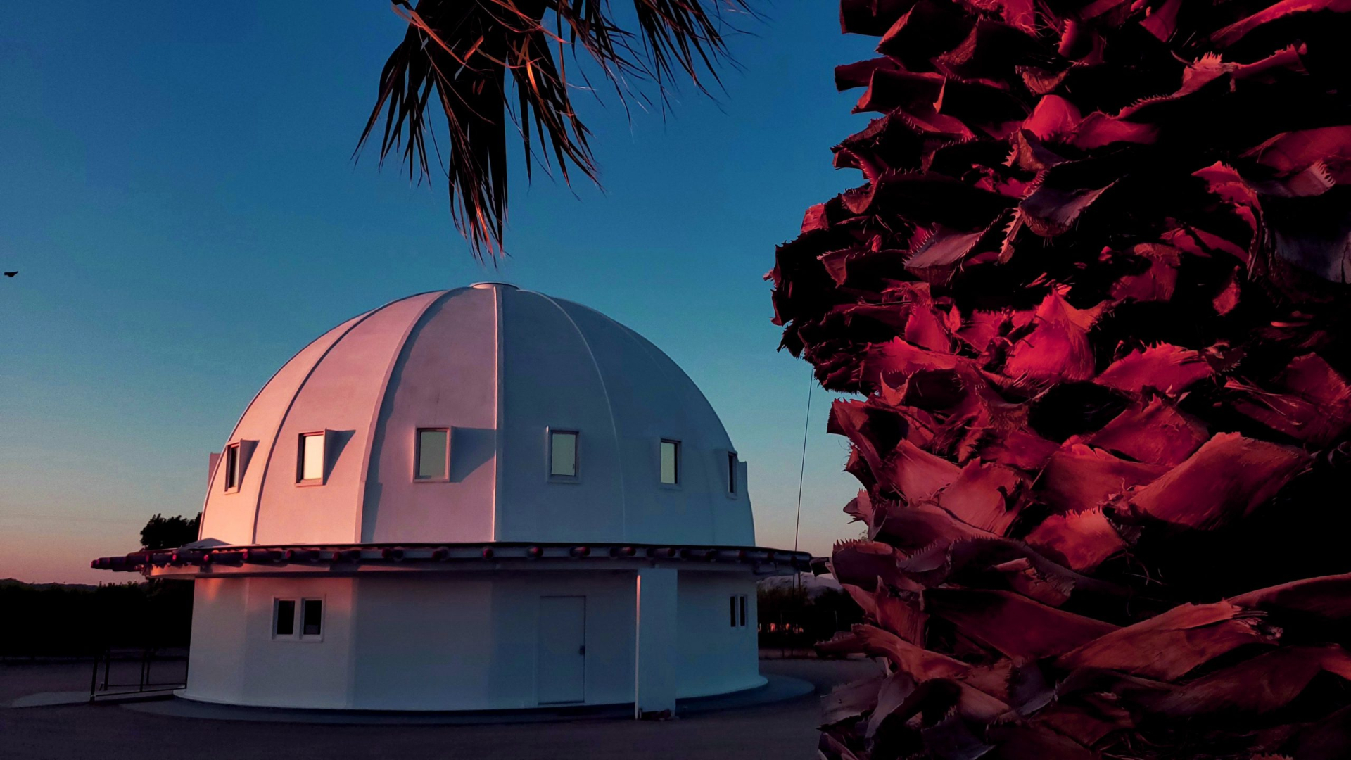 domed building in desert sunset