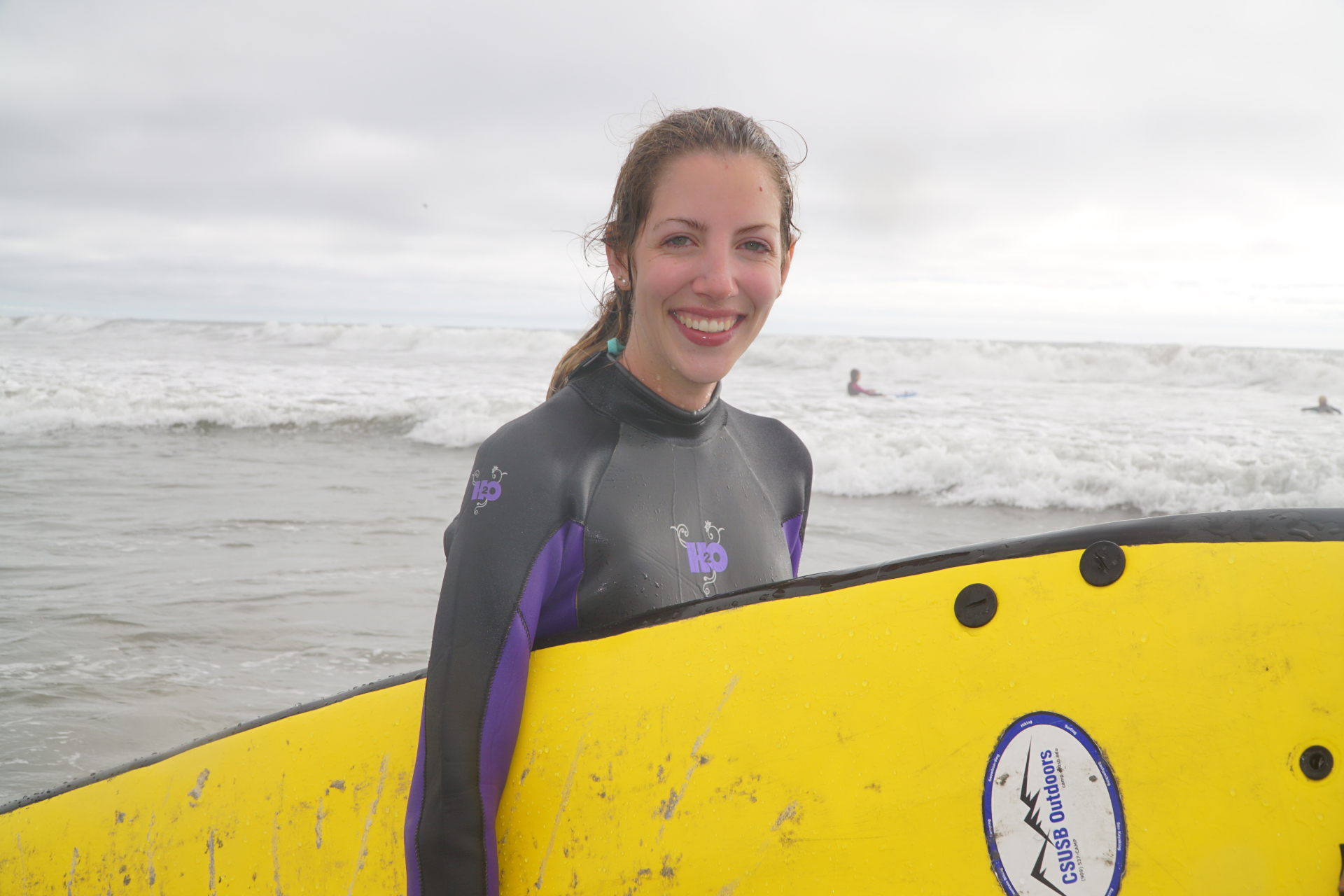 woman holding surfboard