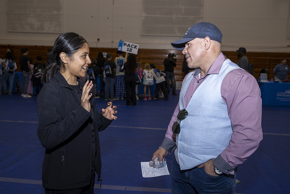 Guillermo Escalante talking with a student.