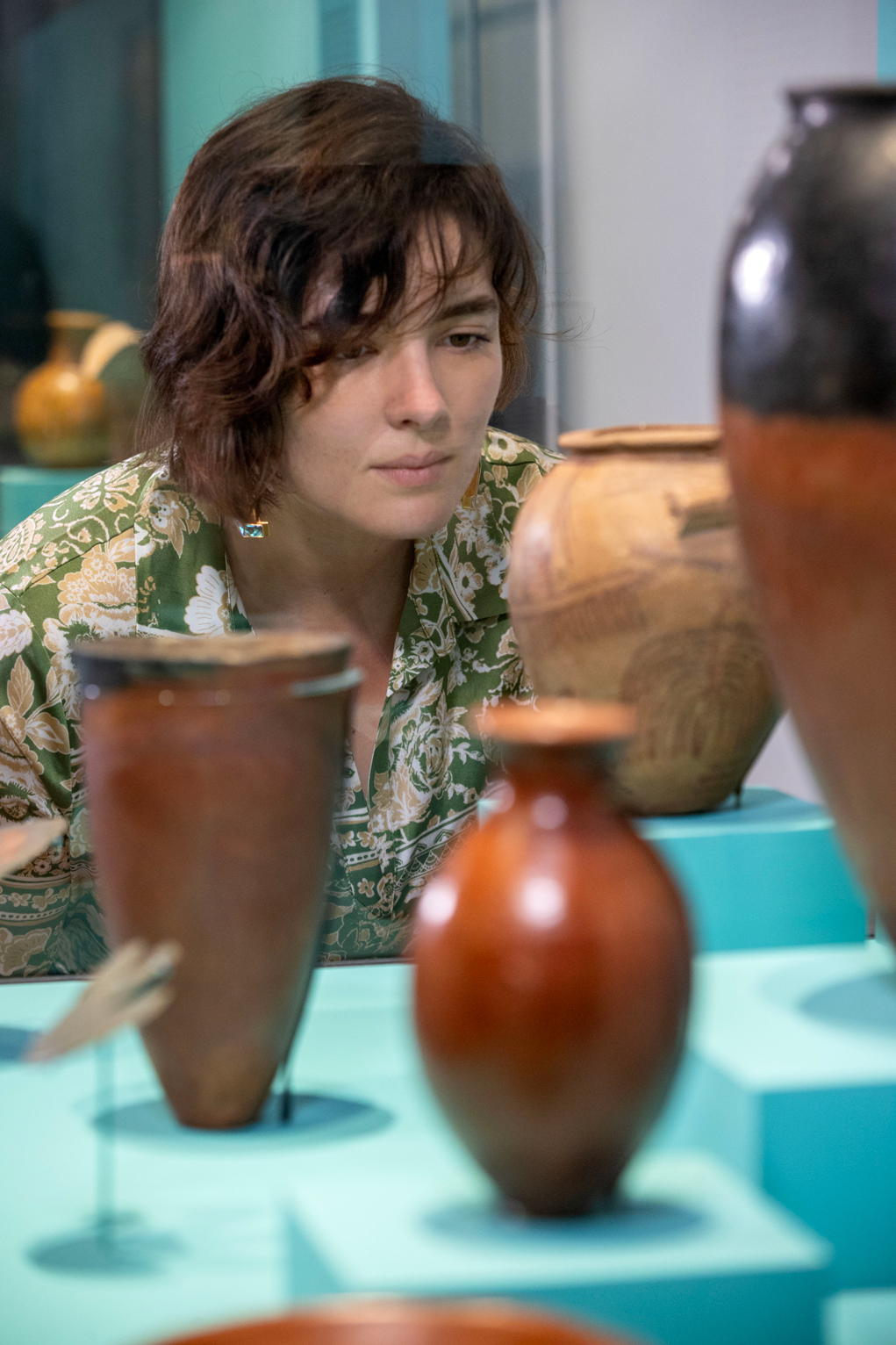 Axelle Brémont looking at a piece from RAFFMA's Egyptian exhibit.