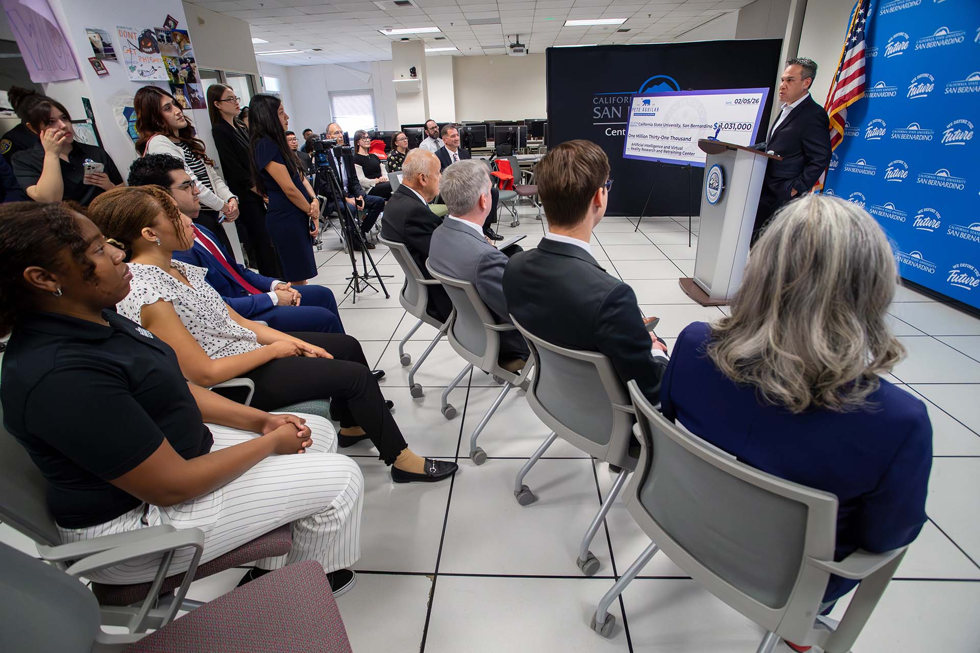 The audience at CSUSB’s Center for Cyber and AI listen as U.S. Pete Aguilar announces the awarding of a grant to establish the Artificial Intelligence and Virtual Reality Research and Retraining Center at the university.