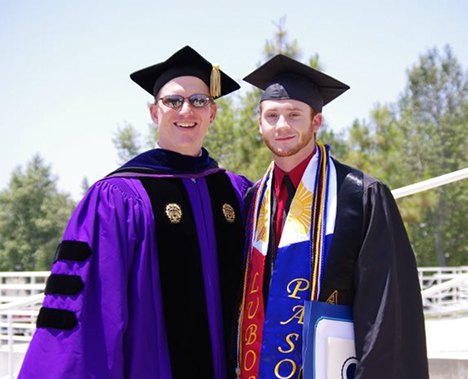 Haakon Brown, left, with Grey at his 2011 CSUSB graduation ceremony.