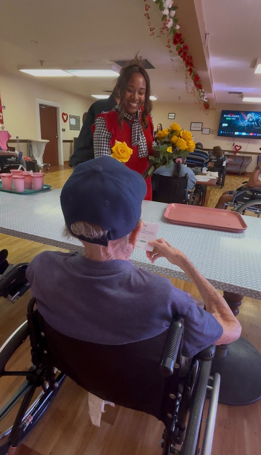  Camelia Fowler, community partnerships analyst in CSUSB’s Office of Community Engaged Learning, delivered a yellow rose to a local senior on Valentine’s Day. 