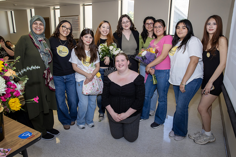 Morris was surrounded by CSUSB students after being named the 2026 Outstanding Faculty Advisor Award recipient. 
