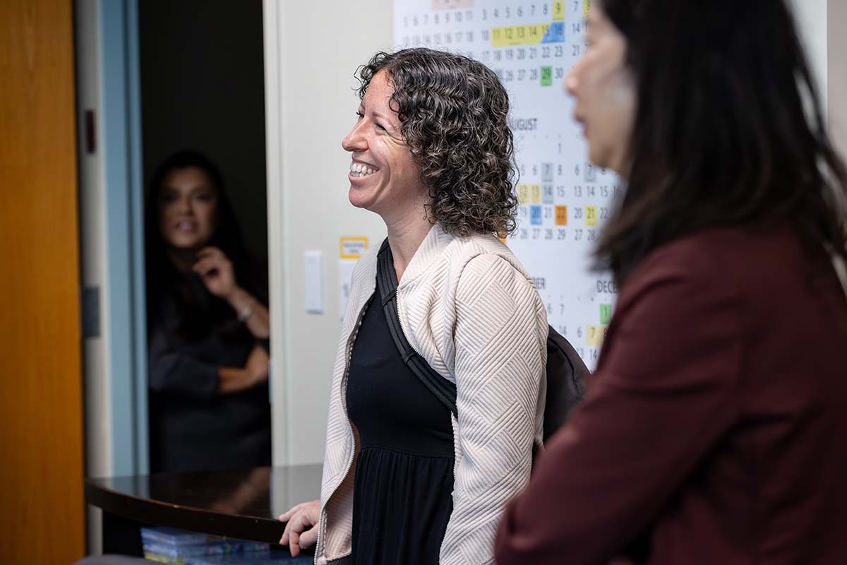 Jessica Nerren smiles as she listens to colleagues during the announcement that she is the 2025-26 Outstanding Lecturer Award recipient.