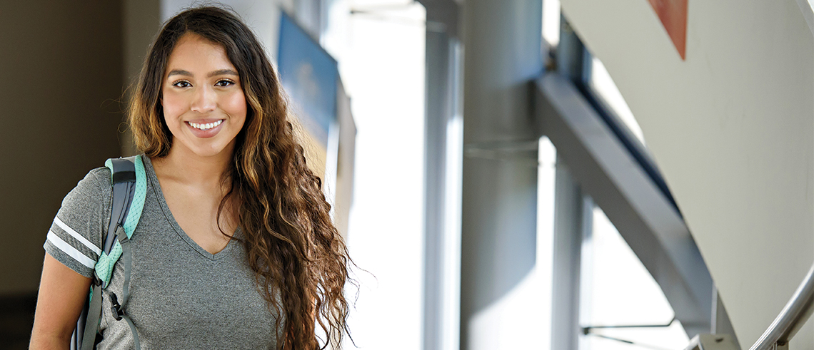 Danielle Lochheart standing in College of Education building