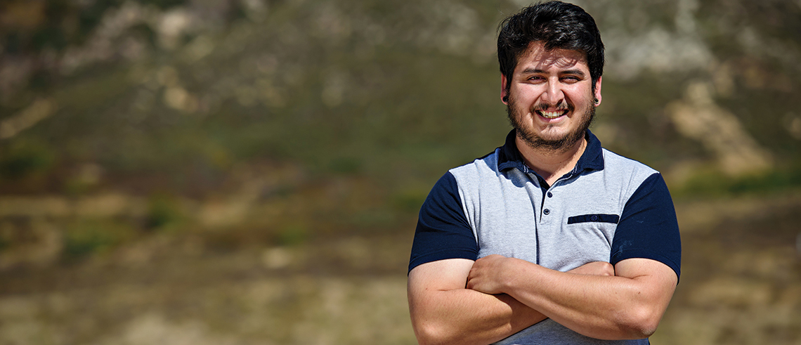 Cesar Morales looking out over the CSUSB campus.