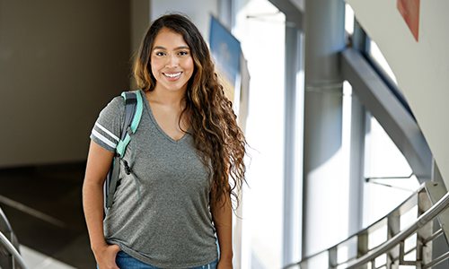 Student standing in building