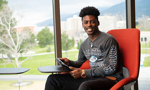 Student sitting by window